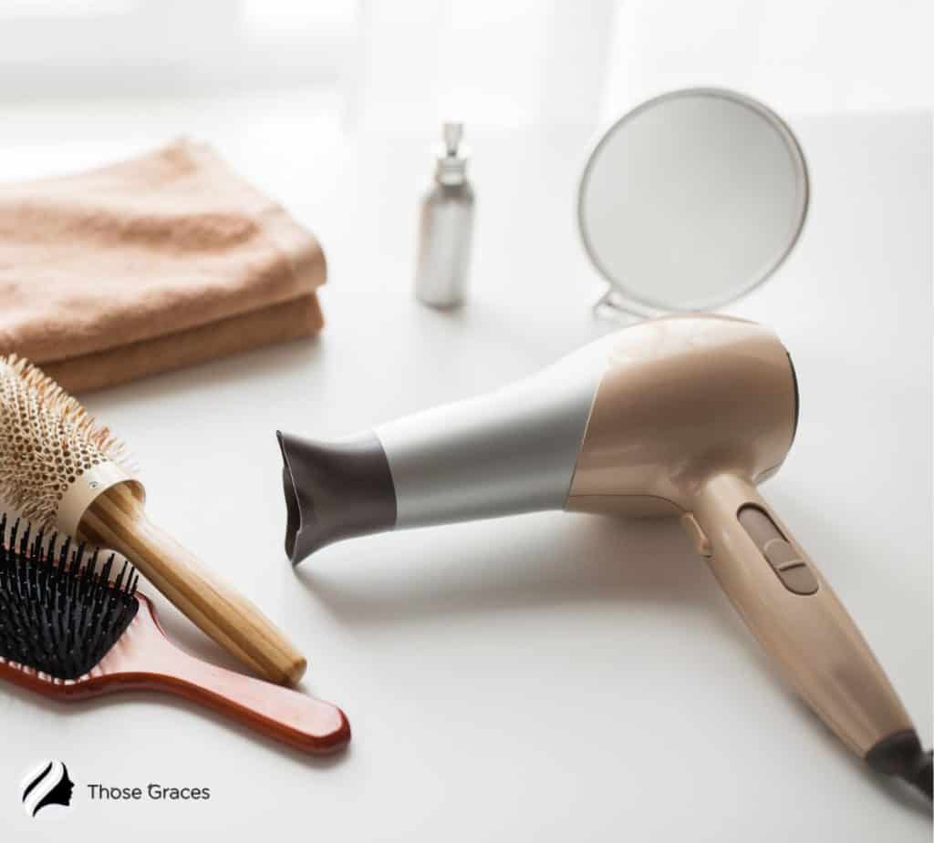 hair dryer and brushes on the table