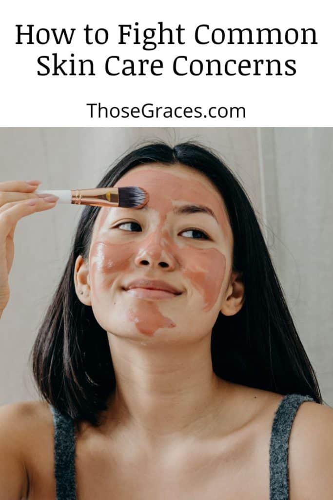 woman putting on clay mask