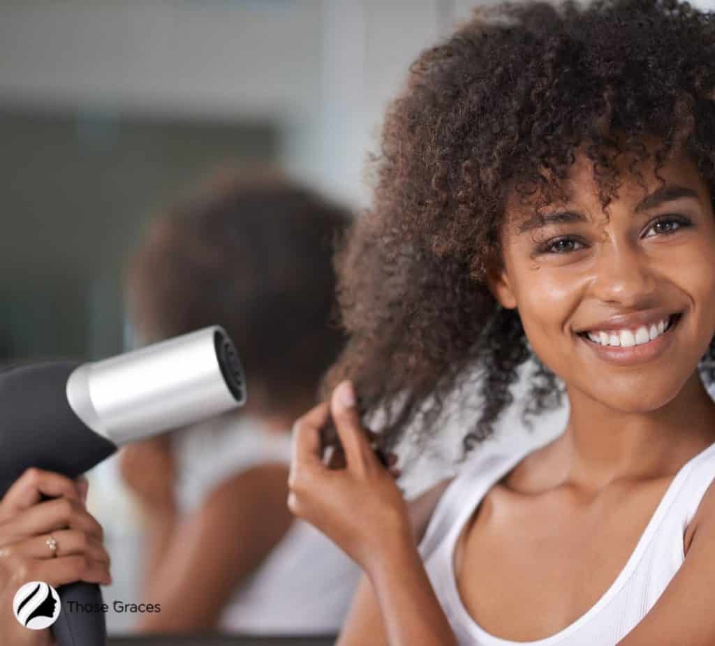 woman blow drying her twist-out hair