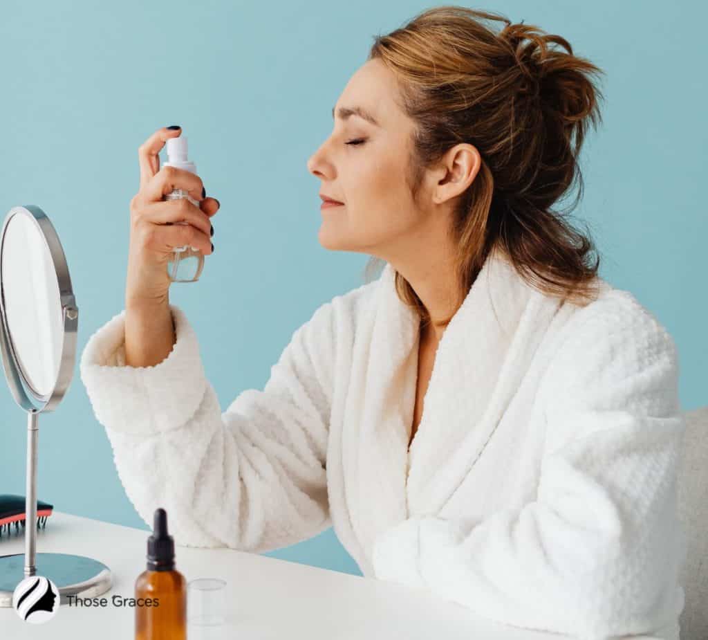 lady spraying her face with mist