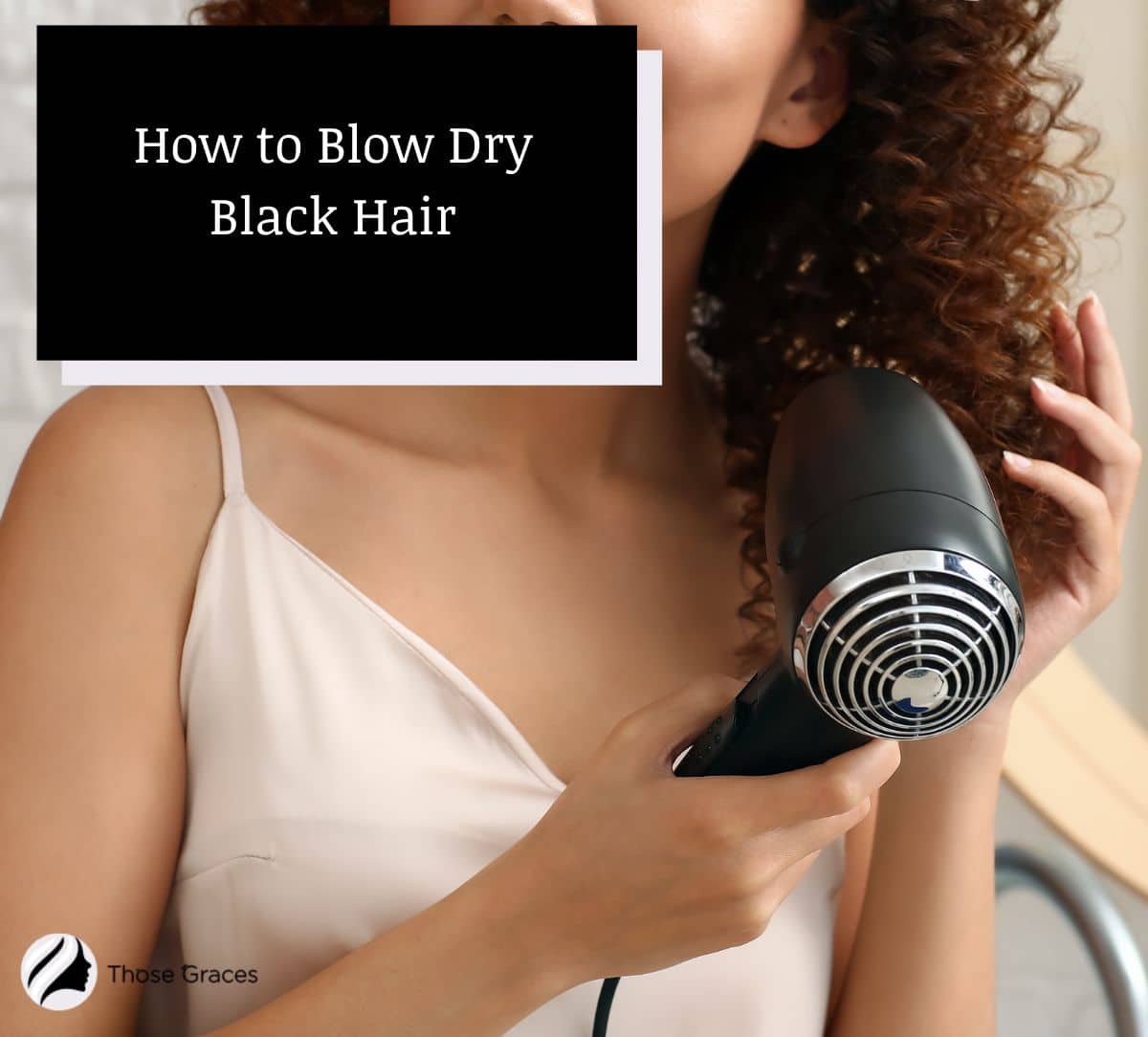 woman showing how to blow dry black hair
